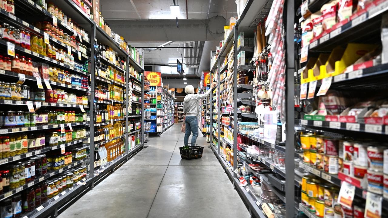 A woman shops at a supermarket in Canberra