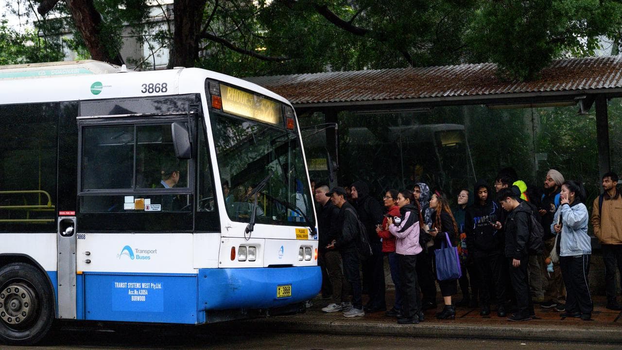 Commuters wait for buses