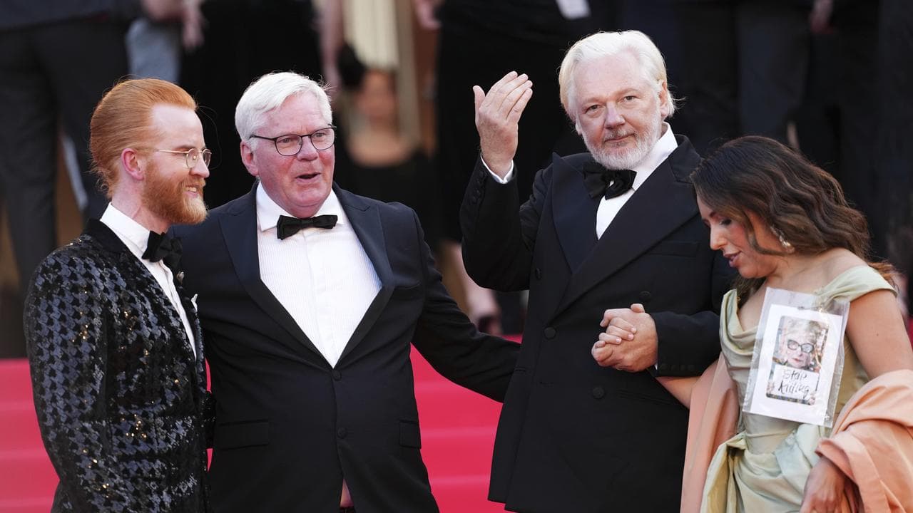 Kristinn Hrafnsson, second from left, Julian and Stella Assange