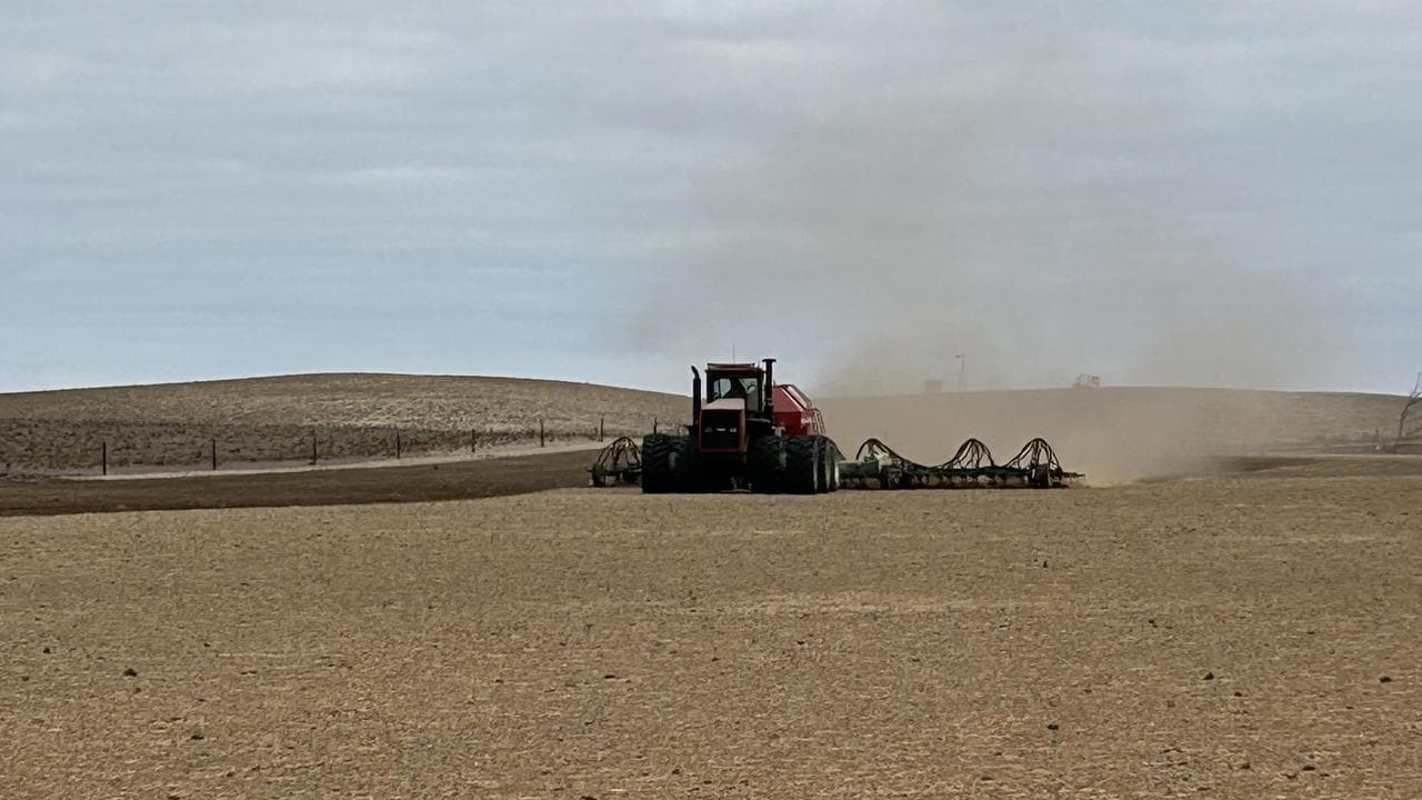 A seeder on a drought-stricken paddock on a farm at Jabuk, SA