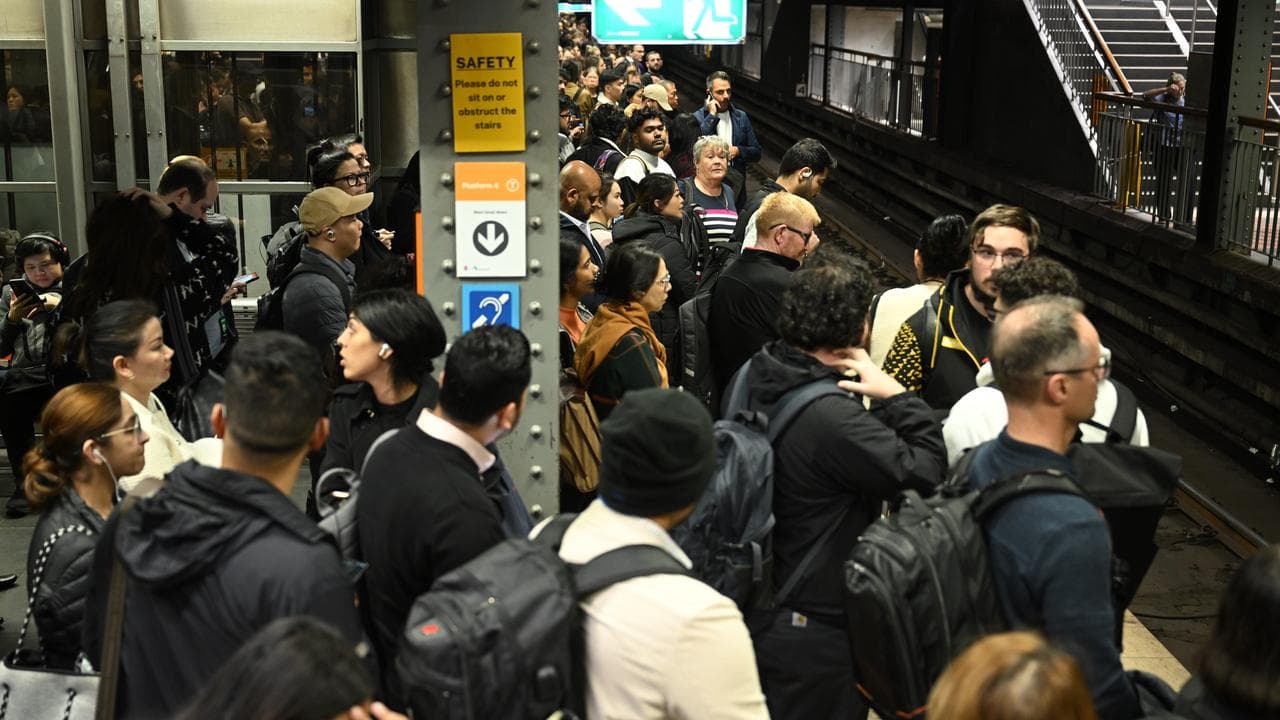 Passengers wait at Town Hall Station (file image)