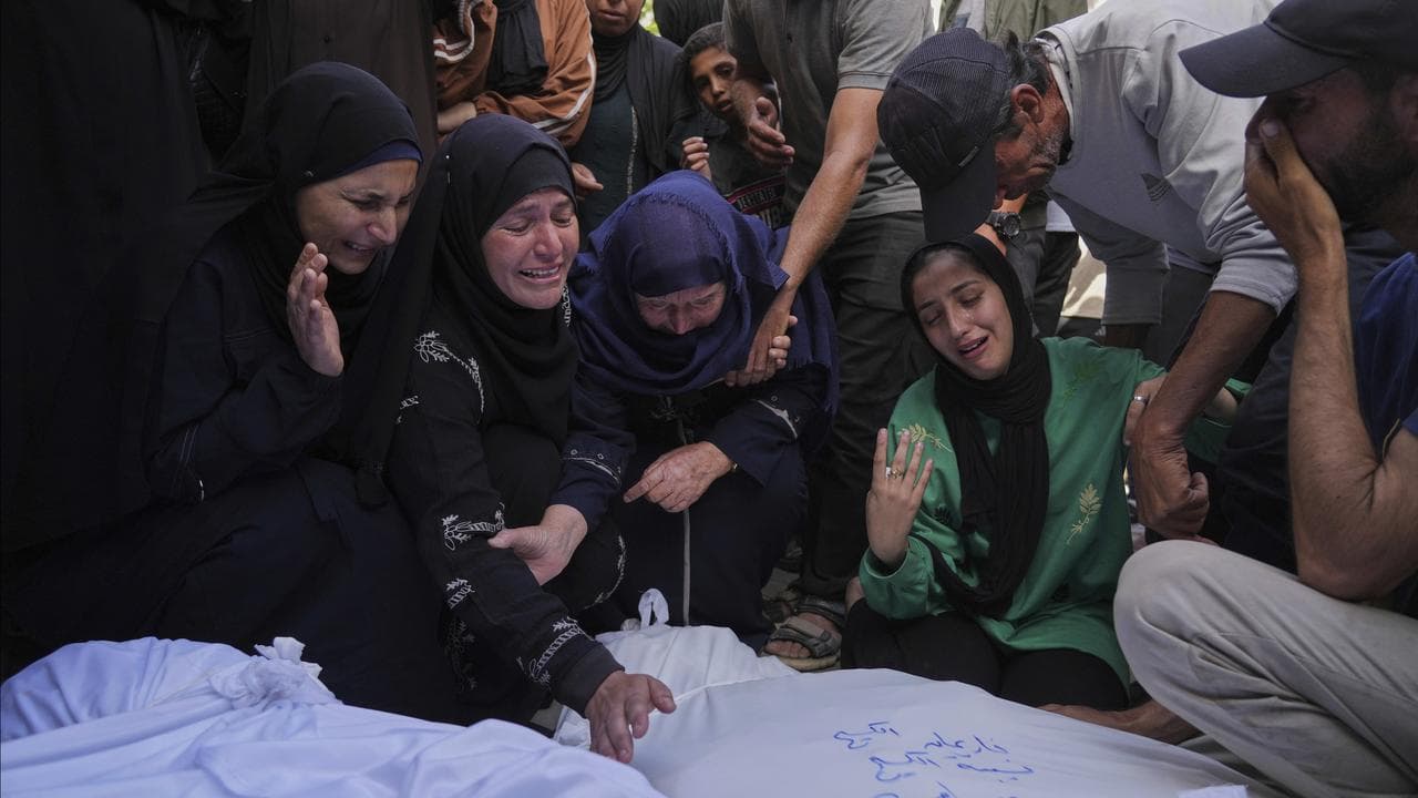 Palestinians mourn relatives killed in an Israeli airstrike