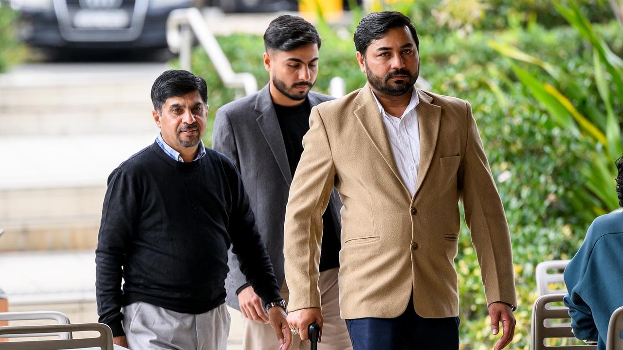 Muzafar Ahmad Tahir (right)