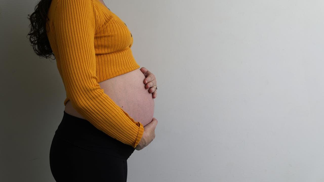 A stock photo of a pregnant woman
