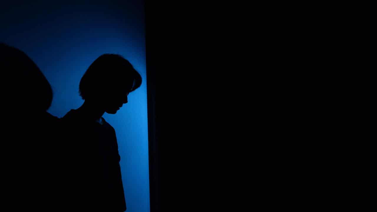 A woman in shadows