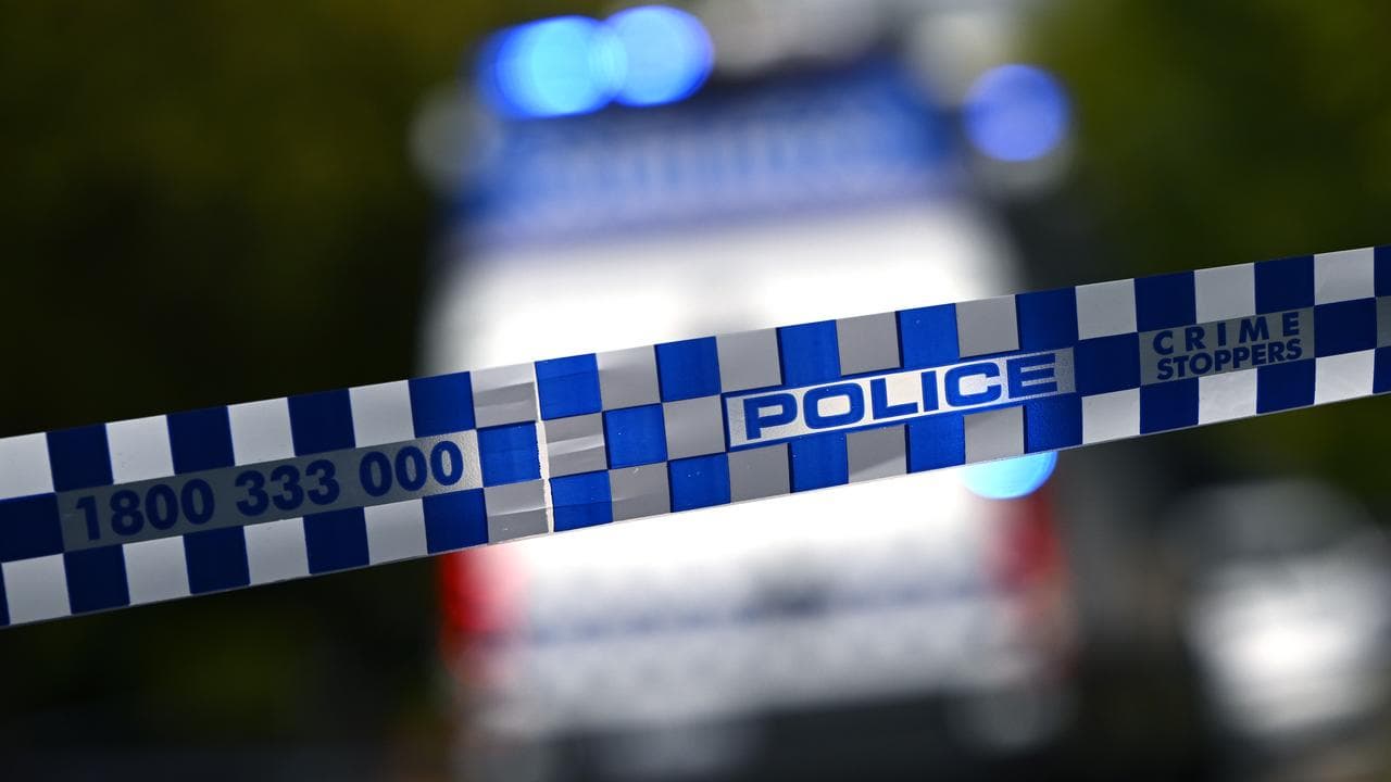 Police tape restricts access to a crime scene