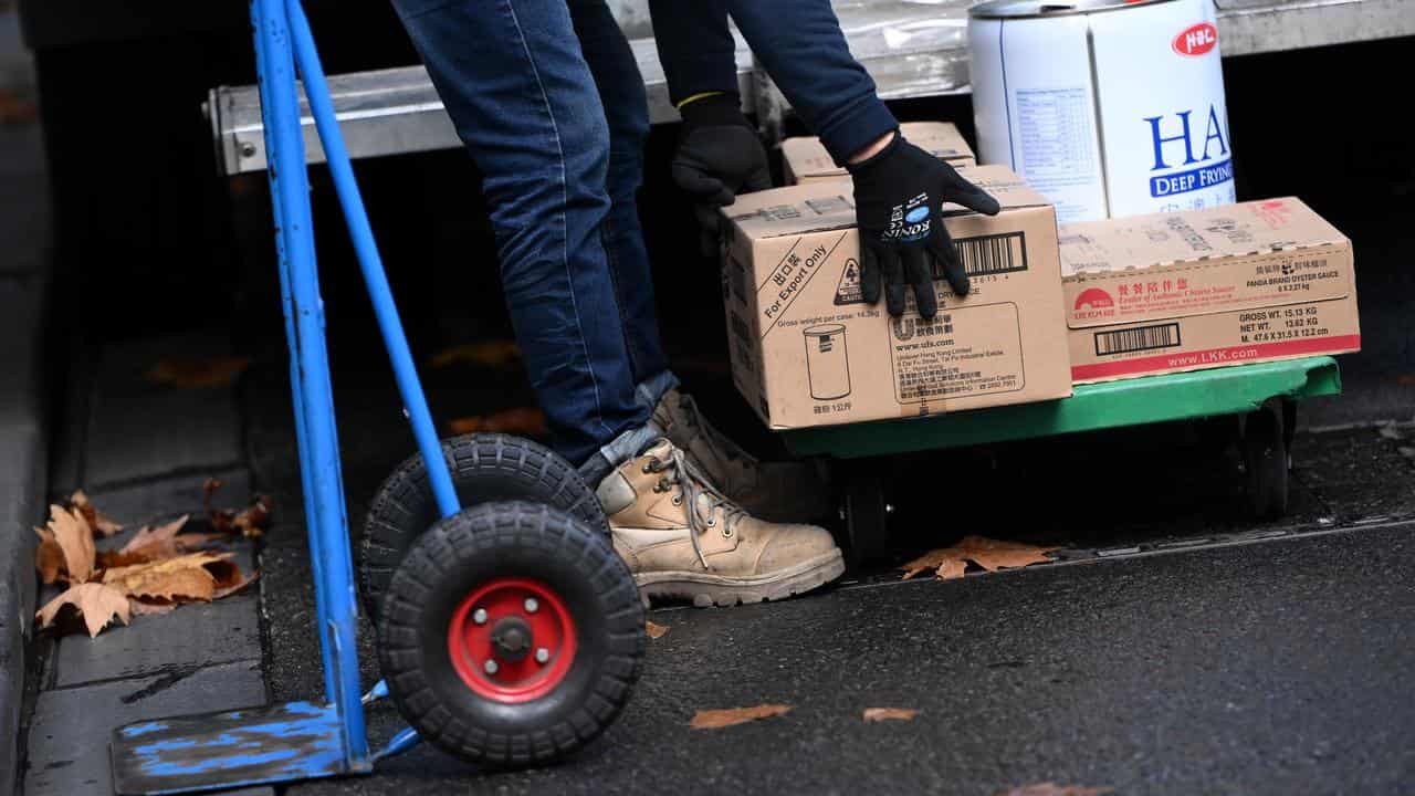 A delivery worker moving boxes