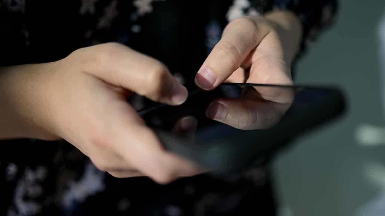 A person using a phone (file image)
