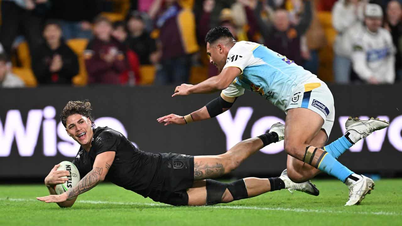 The returning Reece Walsh scored a late double for the Broncos.