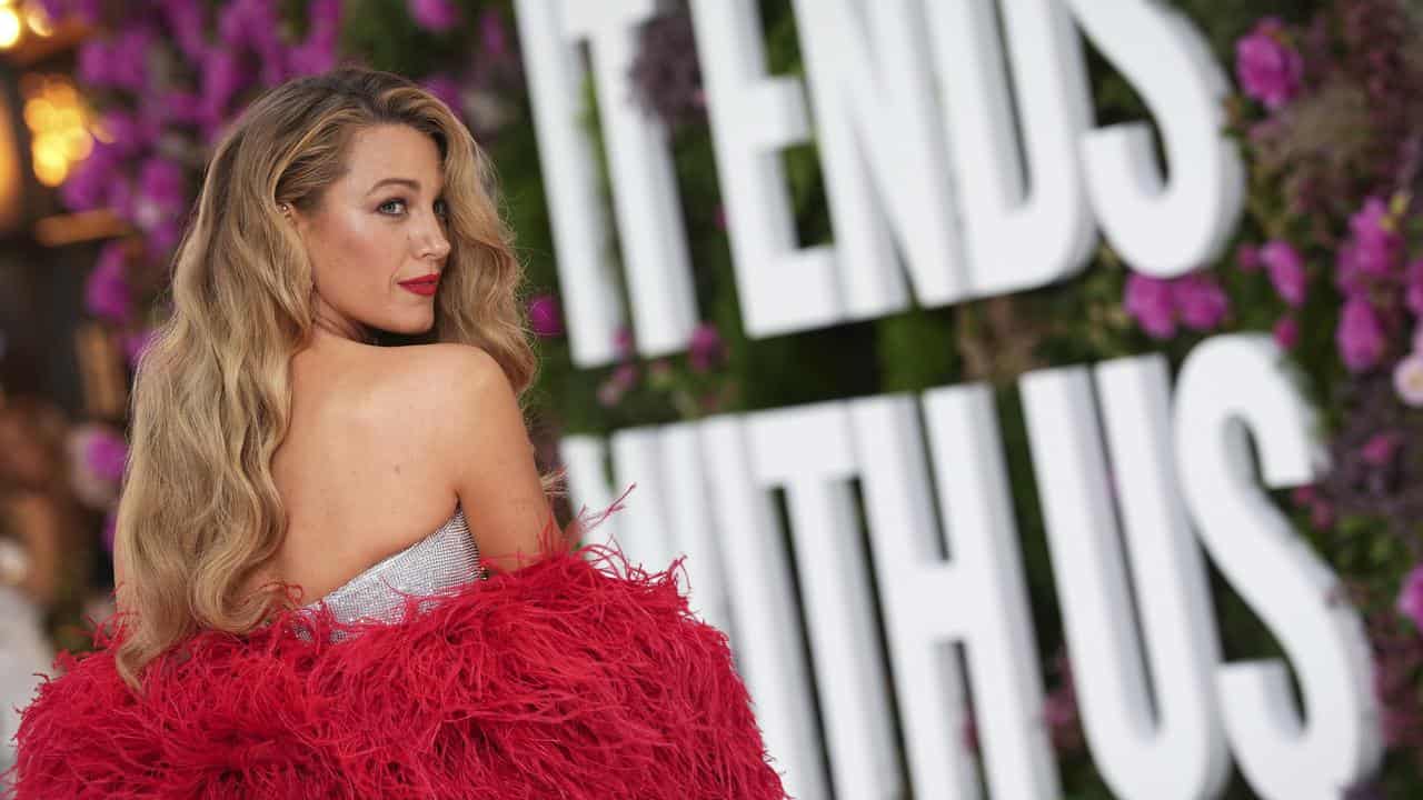 Blake Lively poses for photographers