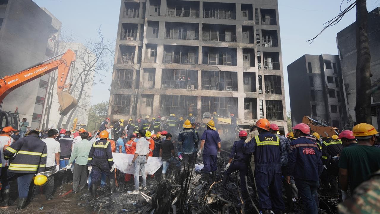 Search and rescue teams at a plane crash site in Ahmedabad.