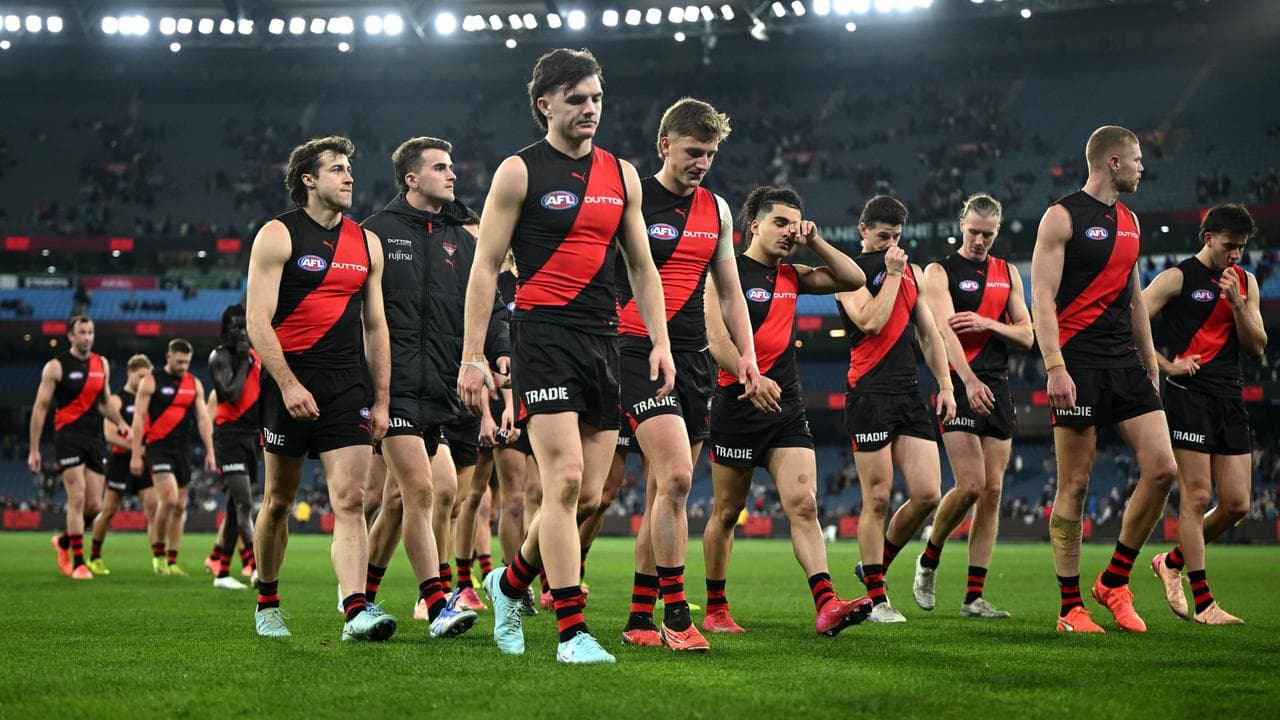 The Bombers leave the MCG after their 95-point thrashing.