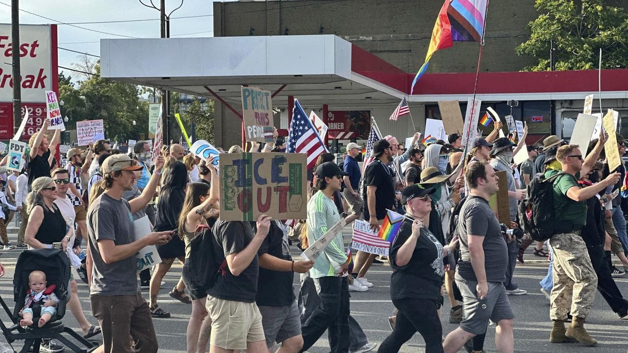 Demonstrators marching during a “No Kings” protest