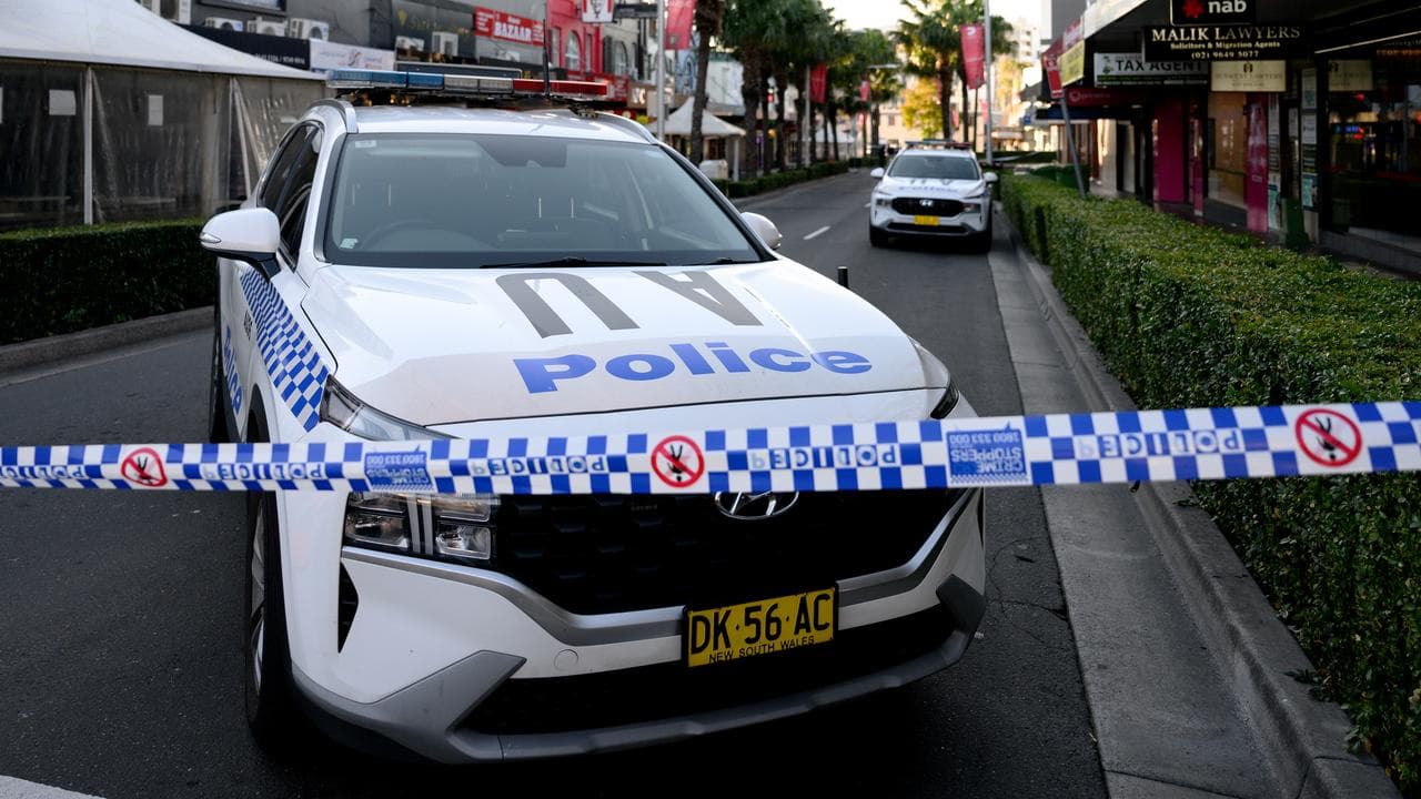 A police car blocks the road due to a public shooting
