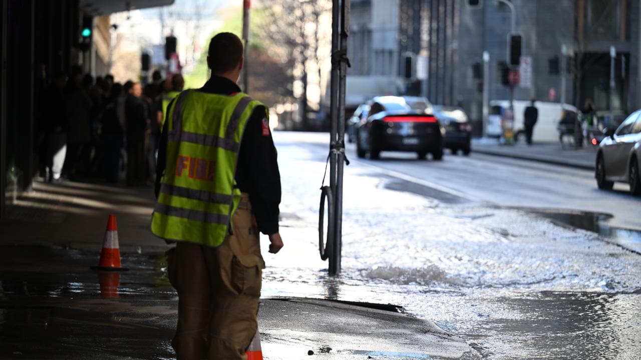A firefighter helps with the evacuation