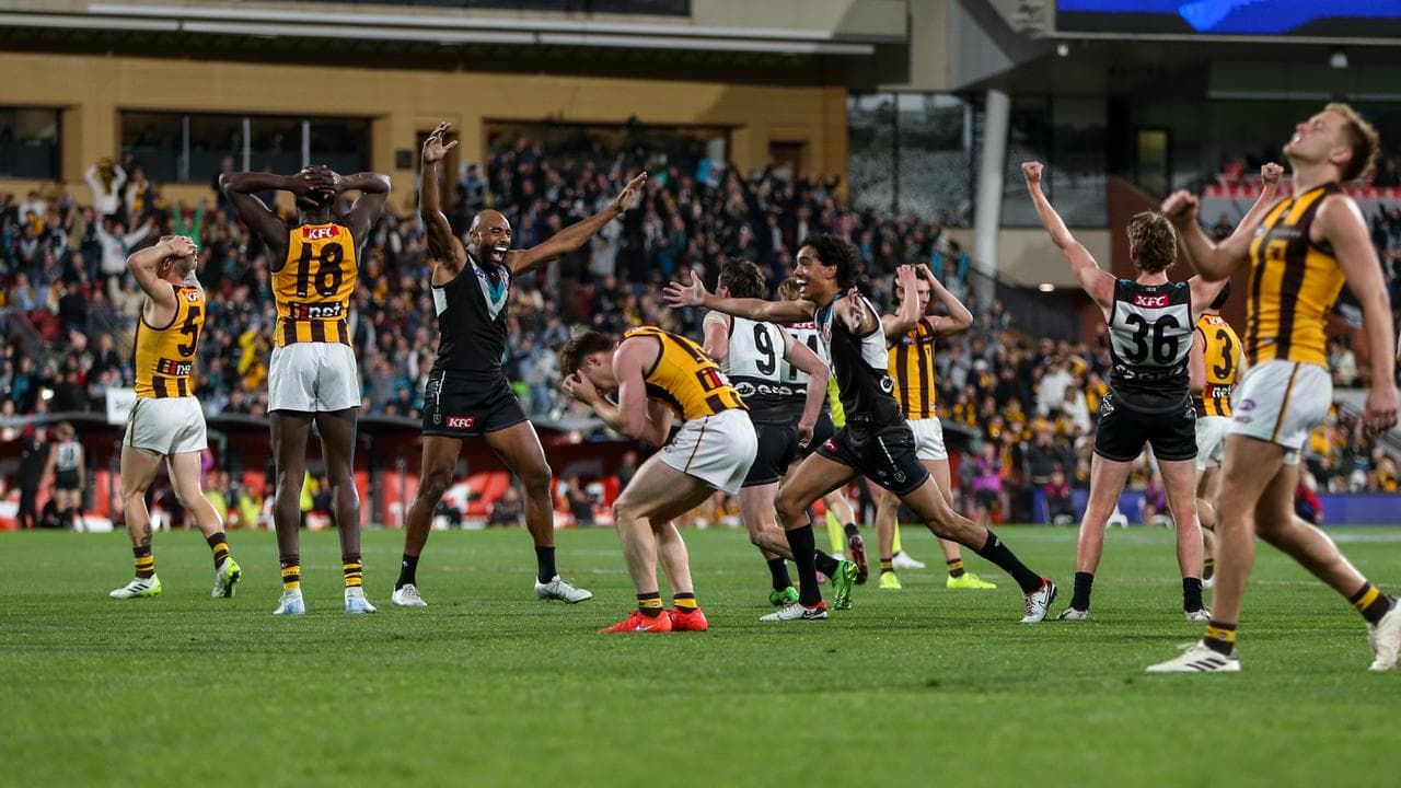 Hawthorn and Port players react after the final siren.