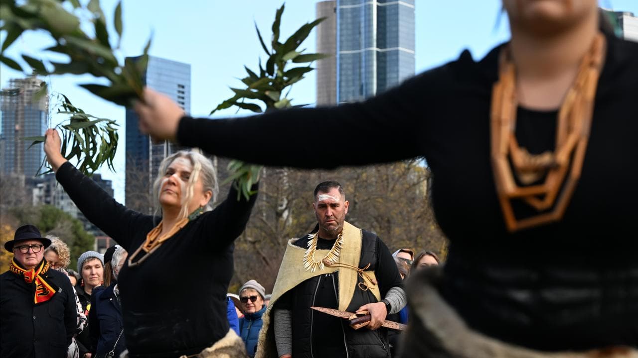 Travis Lovett watches on as Indigenous dancers perform