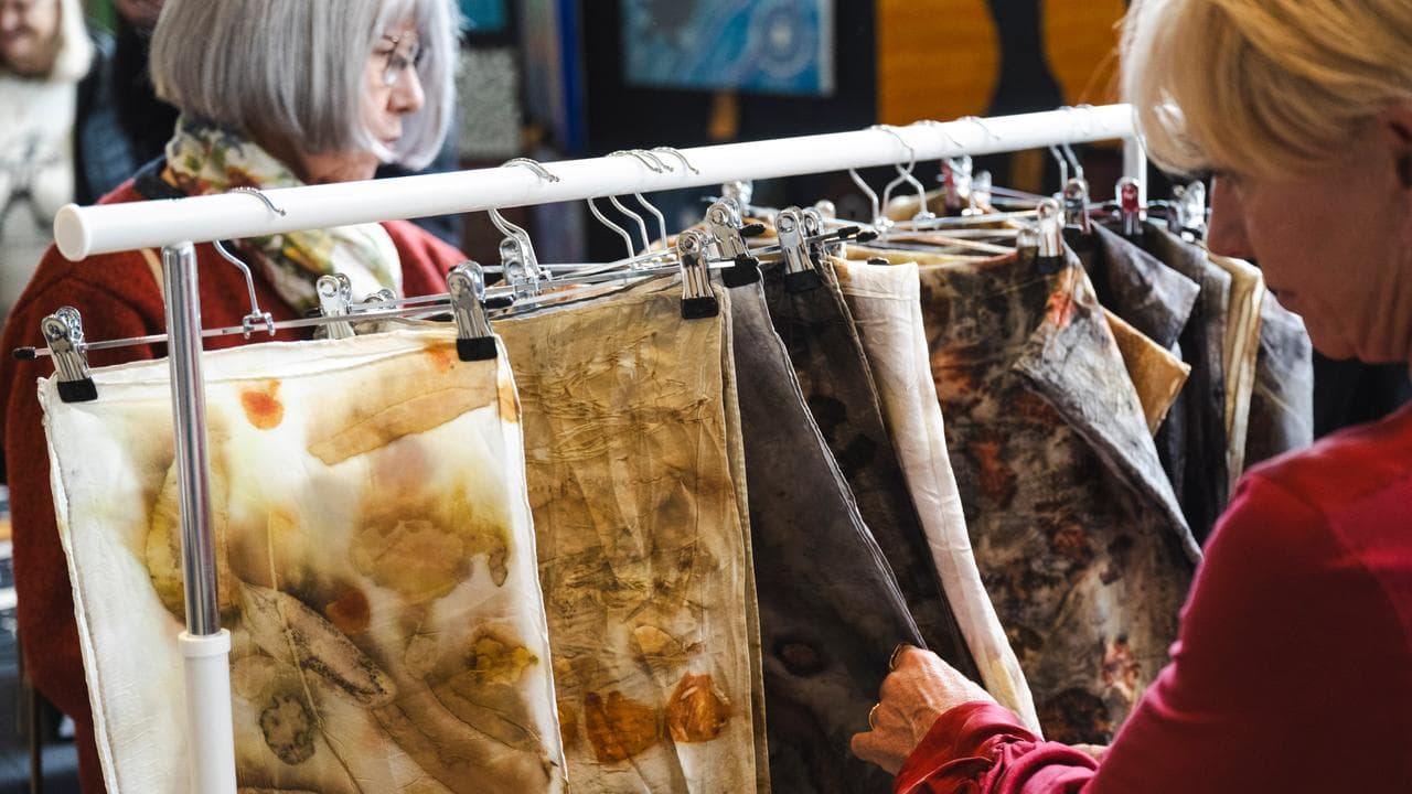 People browsing the textiles on show (file image)