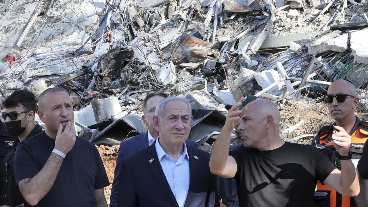 Israeli Prime Minister Benjamin Netanyahu at a missile attack site