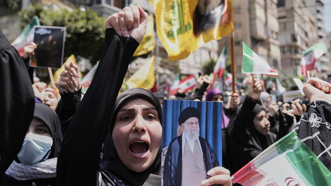 A Hezbollah supporter in Beirut protests over Israel's attack on Iran
