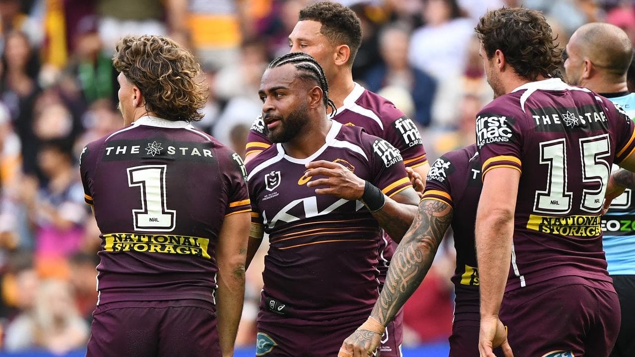 Brisbane teammates congratulate Ezra Mam (second left)