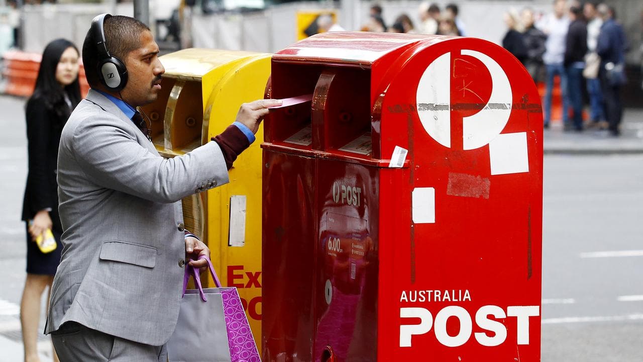 A person posts a letter (file image)