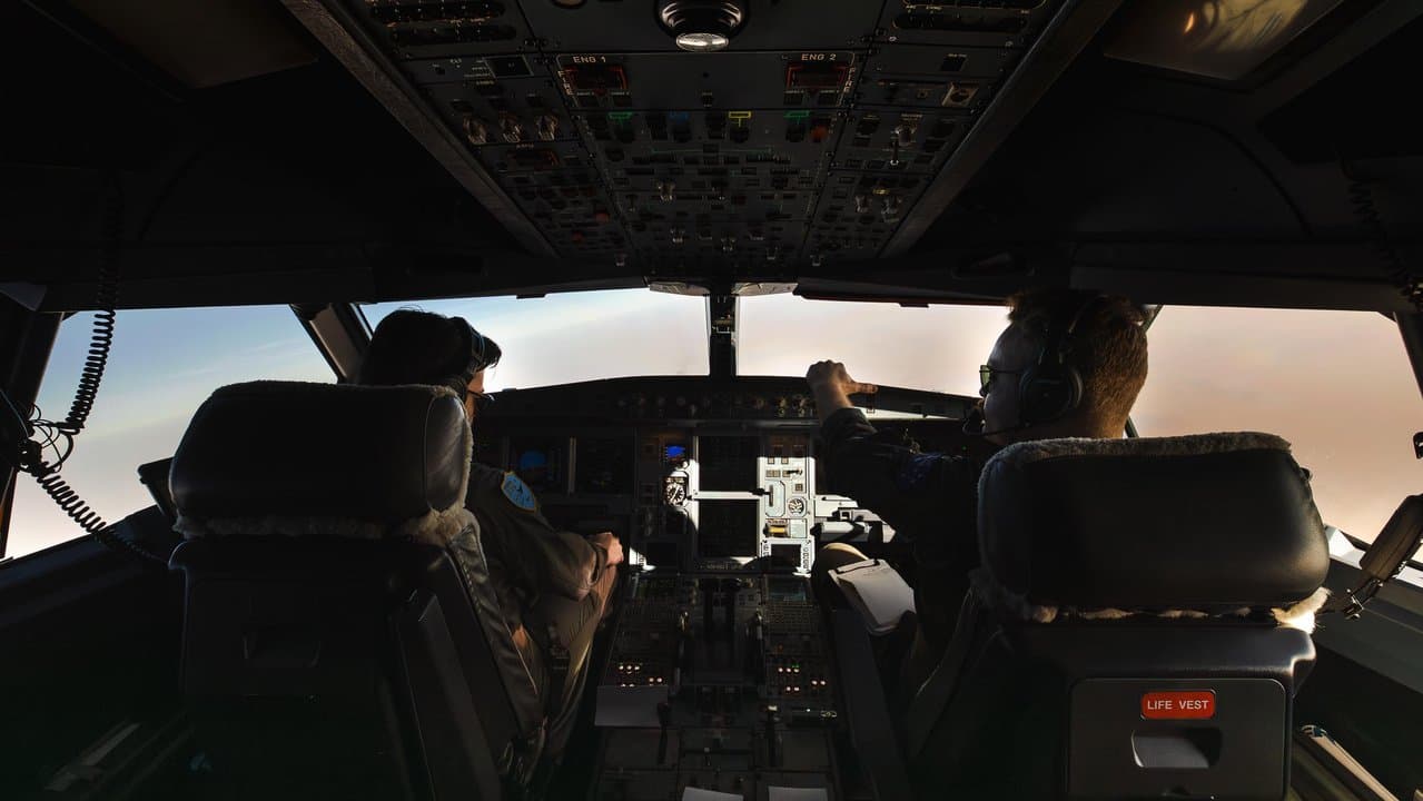 RAAF pilots in the cockpit of one of the repatriation planes.