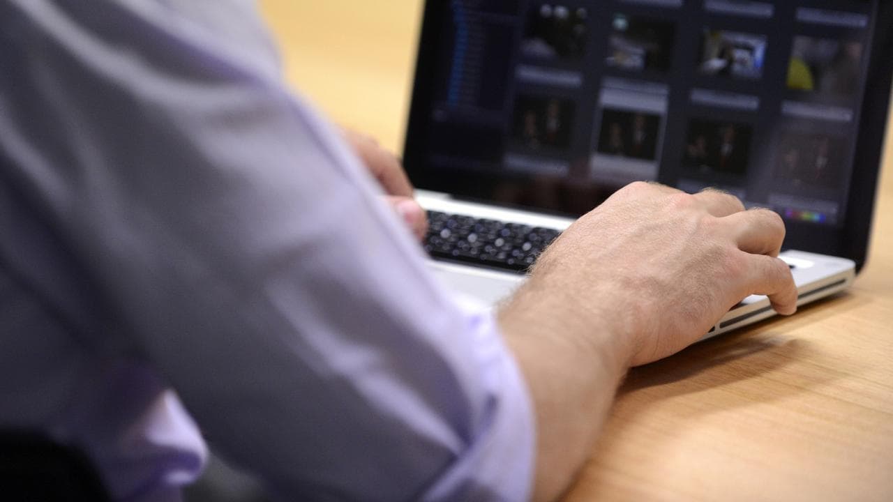 A man uses a laptop computer (file image)