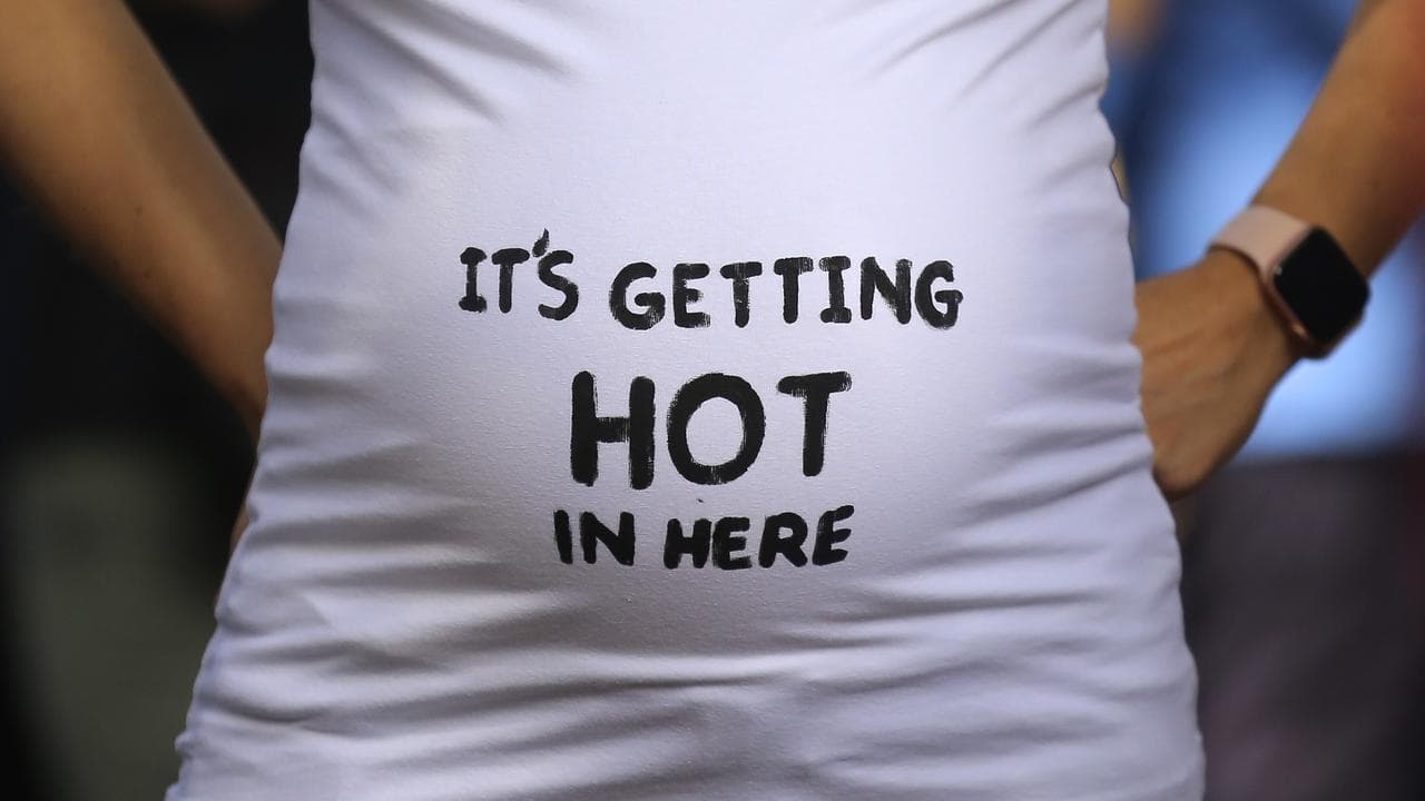 Pregnant climate protester at a rally in Sydney