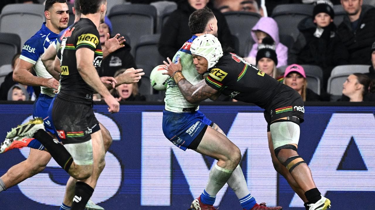 Brian To'o lays a strong tackle on Bronson Xerri