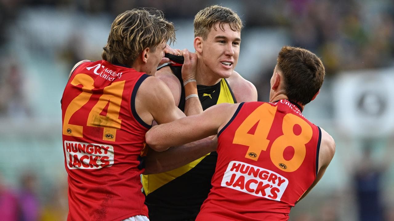 Josh Worrell (left) and Mark Keane  with Richmond's Tom Lynch.