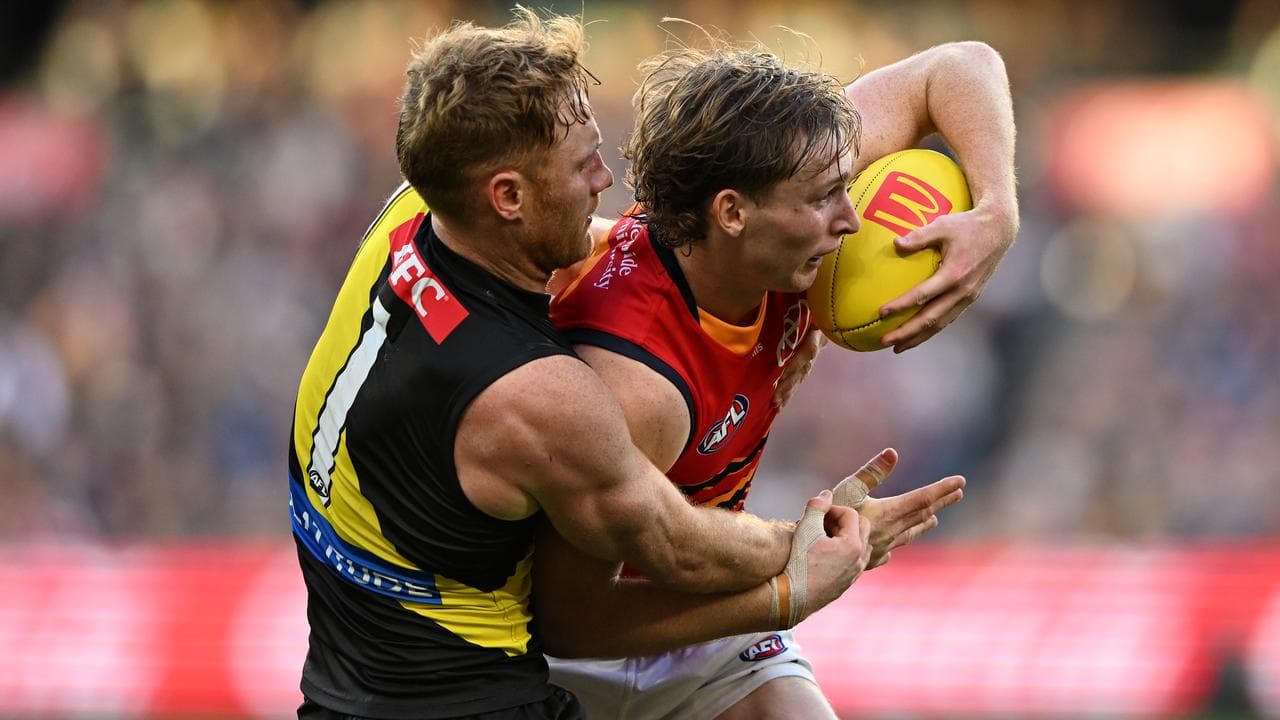 Nick Vlastuin (left) tries to keep Adelaide's Max Michalanney in check