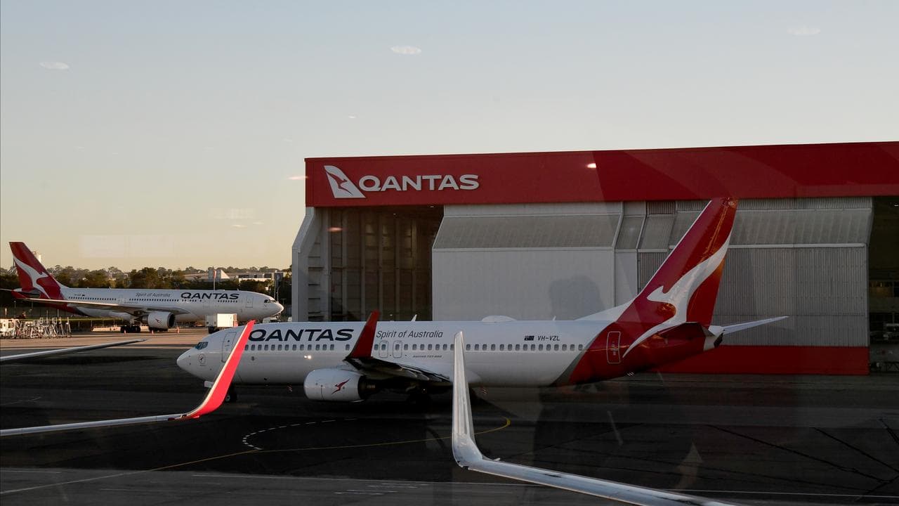 Qantas aircrafts are seen on the tarmac at Sydney Airport,