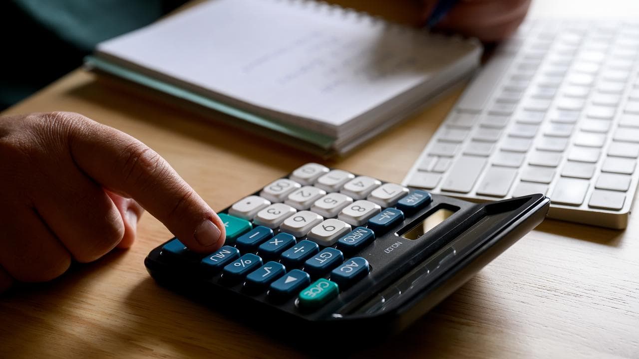 Person uses calculator