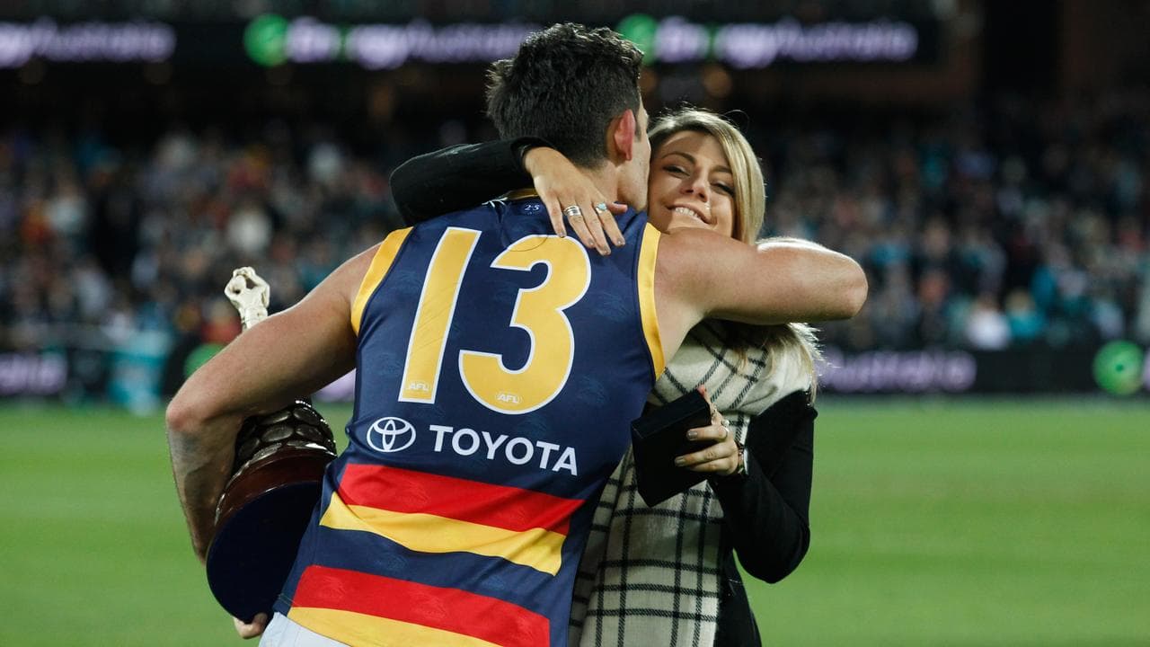 (L-R) Taylor Walker hugs Quinn Walsh.