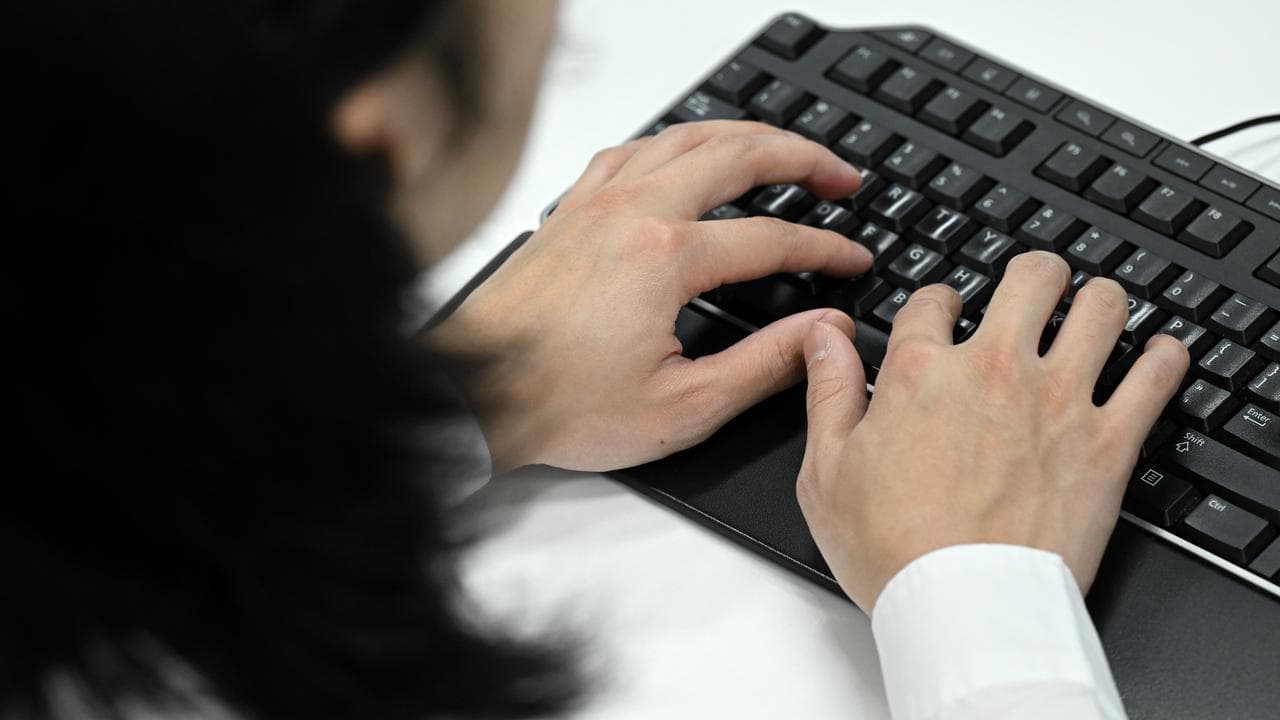 A stock photo of a computer user