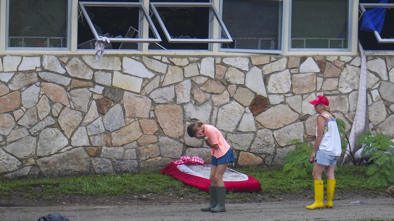 People react at Camp Mystic in Texas after the flooding