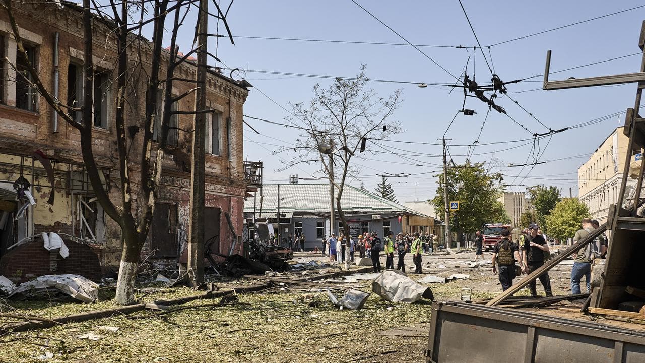 Emergency workers inspect site of drone attack