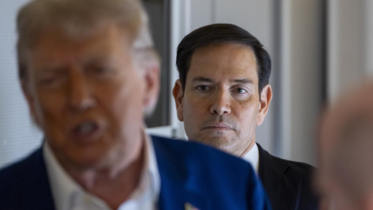 Secretary of State Marco Rubio stands behind President Donald Trump
