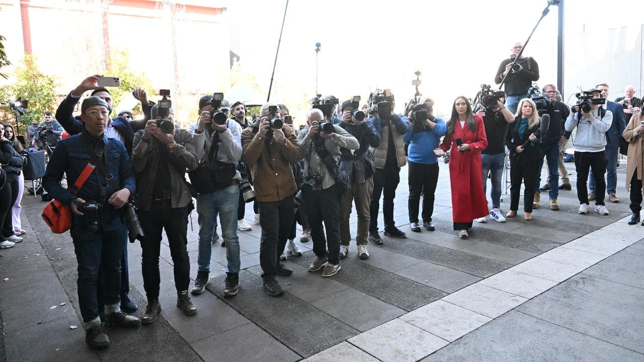Media gather outside the Latrobe Valley Magistrates Court in Morwell