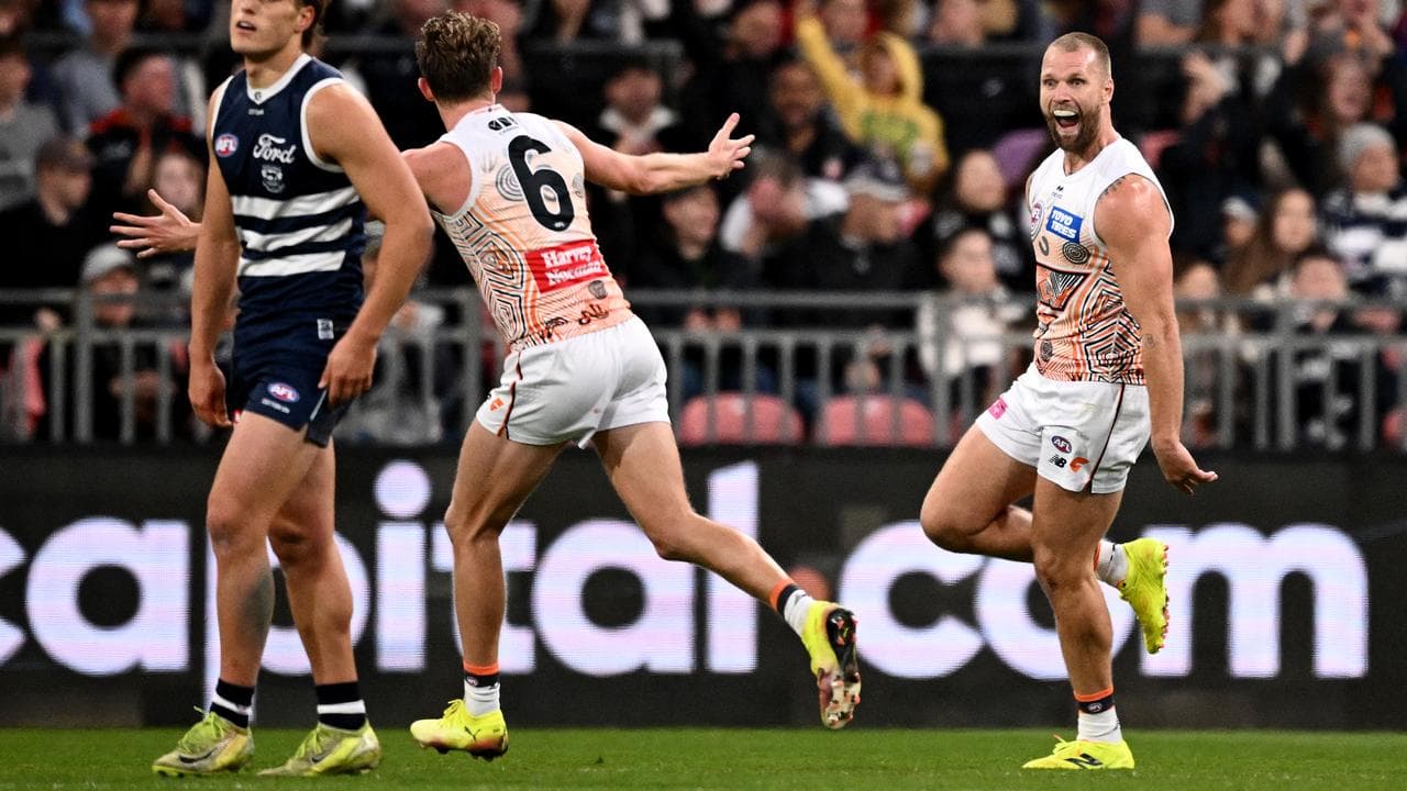 Jake Stringer of the Giants (right).