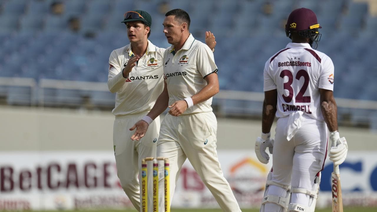 Sam Konstas (left) congratulates Scott Boland.