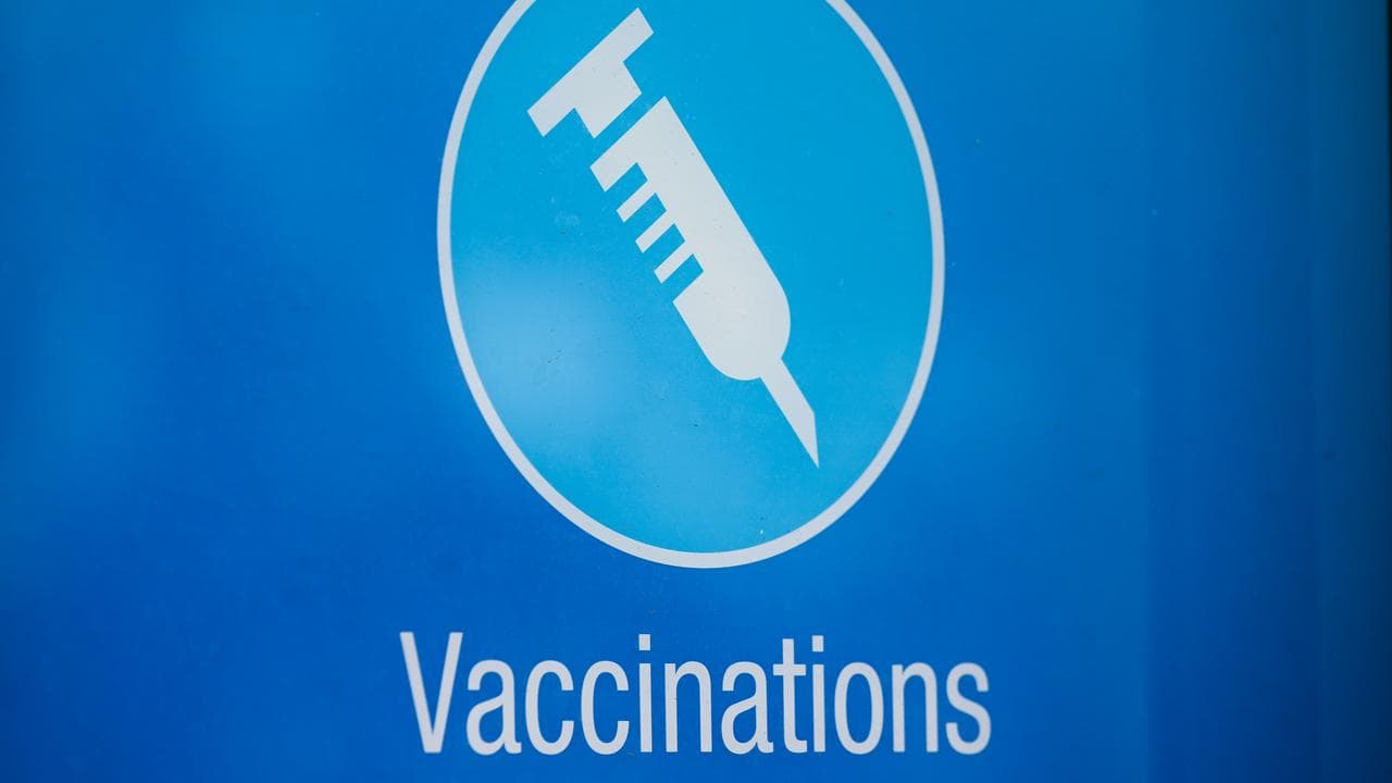 Sign advertising vaccinations at a Canberra pharmacy, July 18, 2023.