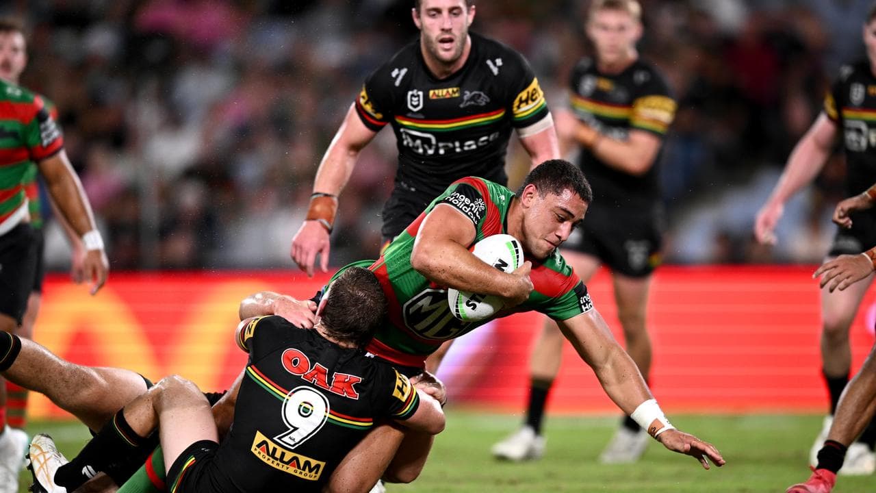 Penrith players effect a tackle.