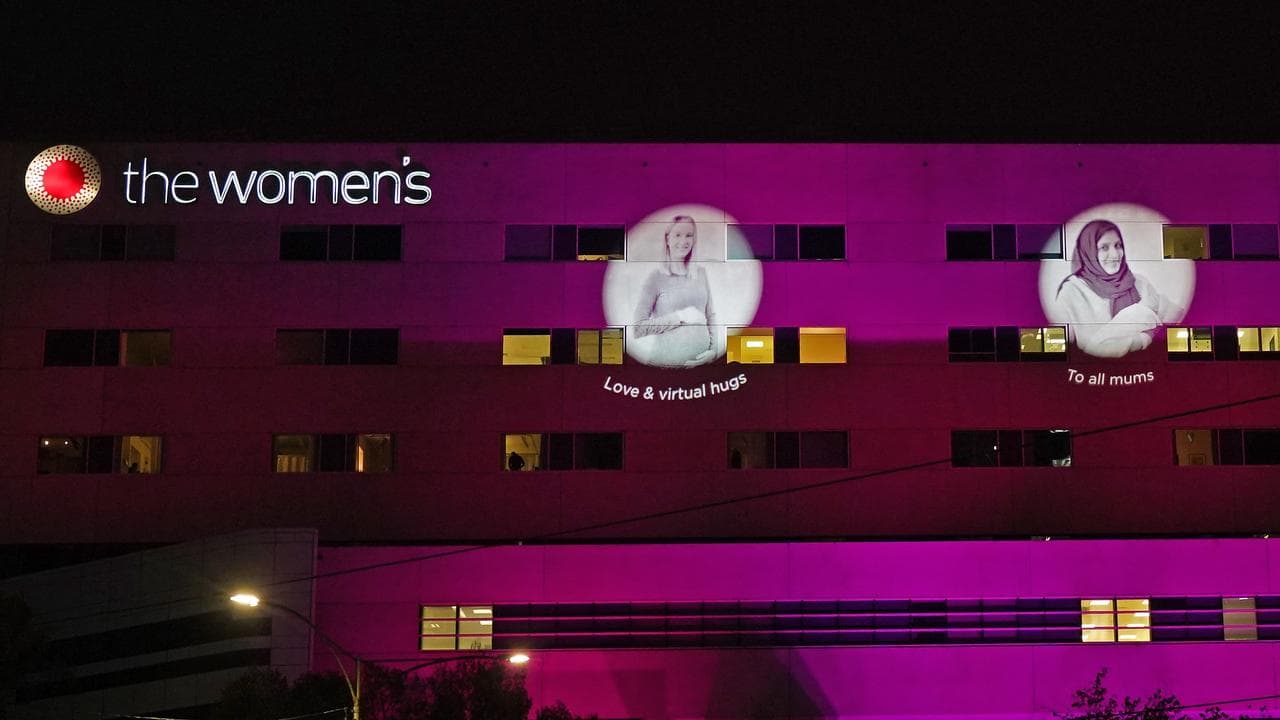 The facade of The Royal Women's Hospital lights up pink (file)