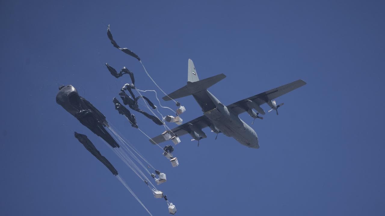 Humanitarian aid is airdropped to Palestinians over Gaza City