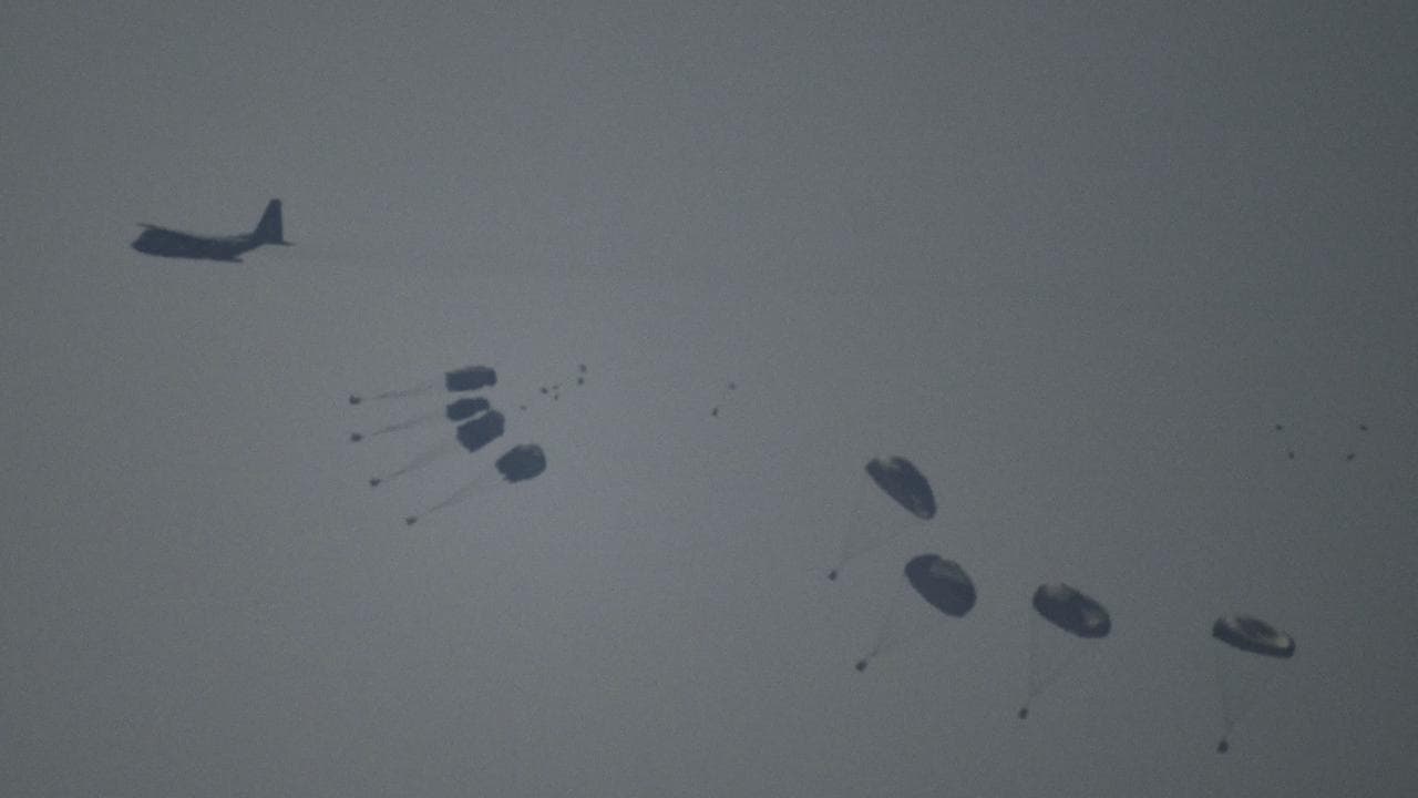 An aircraft airdrops humanitarian aid over the northern Gaza Strip