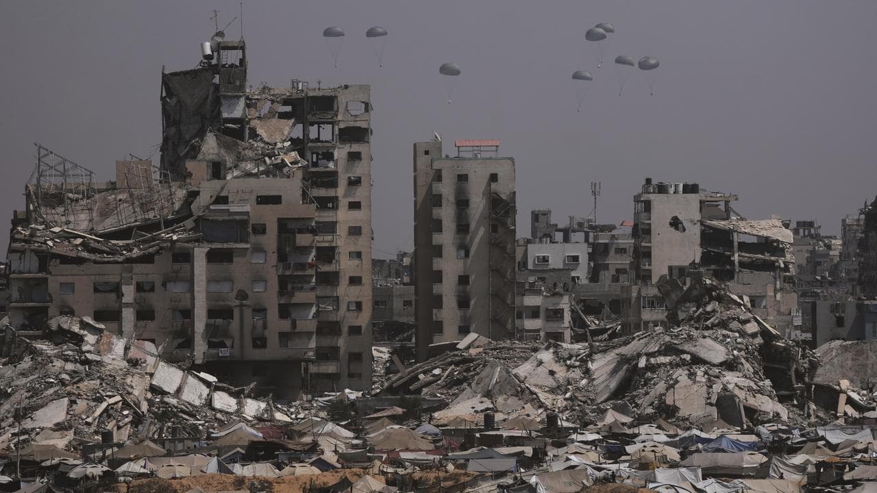 Humanitarian aid is airdropped to Palestinians over Gaza City