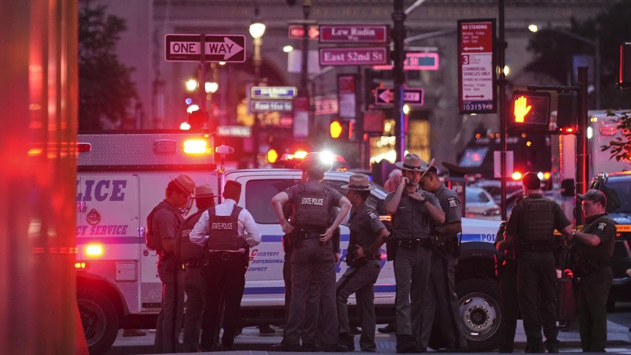 State troopers gather outside a Manhattan office building