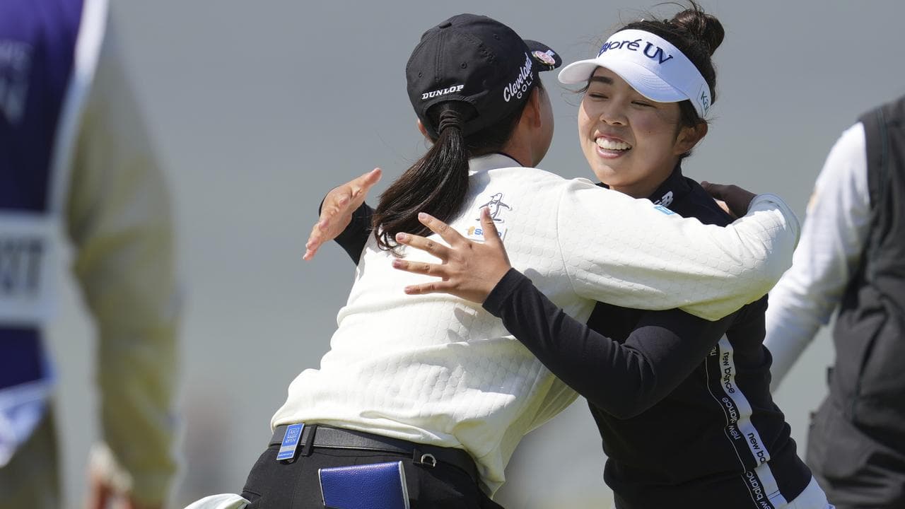 Miyu Yamashita, right, hugs Rio Takeda